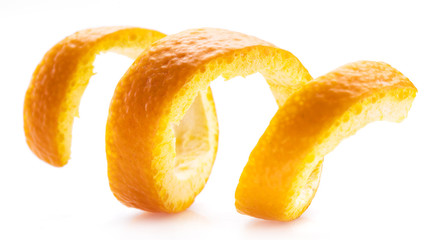 Orange peel or orange twist on white background. Close-up.