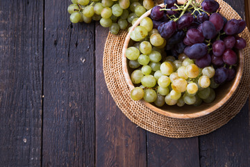 Healthy fruits Red and White wine grapes on swooden  backgrounds