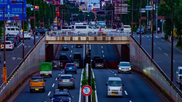 A timelapse of downtown street at Kanpachi avenue in Tokyo daytime long shot zoom