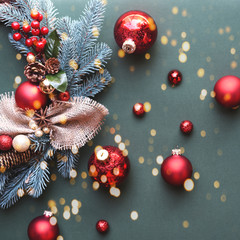 Fototapeta na wymiar Christmas wreath with toys on the Christmas tree on a green background.