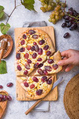 pizza crust with goat's cheese and red grapes. Vegetarian, grain free, low carb, gluten free diet concept