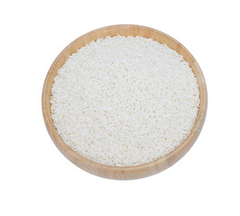 Top view Raw, parboiled rice in a wooden bowl. Rice dish, isolated on white background with clipping path.