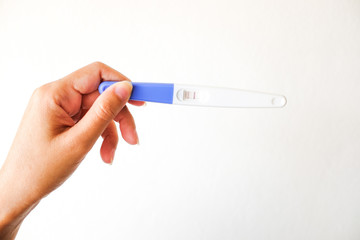 Positive pregnancy test on Woman Hand