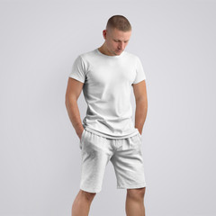 Stylish slim model  in a blank T-shirt on a white studio background.