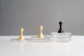 Chess piece standing out from others on light background. Think different business unique independent concept.