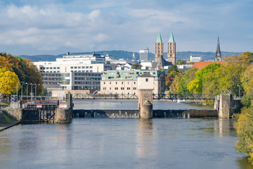 View over the river Fulda with its lock to the city center of Kassel, Germany, on a sunny autumn day