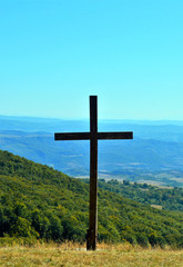 a cross on a hill
