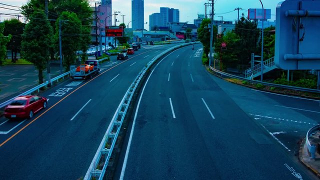 A timelapse of downtown street at Kanpachi avenue in Tokyo daytime wide shot panning