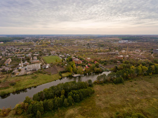 Naklejka premium European village, river, forest. Aerial view.