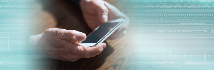 Hands using a phone; panoramic banner