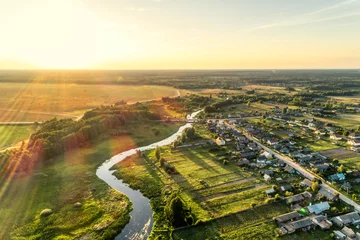 Fotobehang Aerial view. Small european village. Blue winding river. © nordroden
