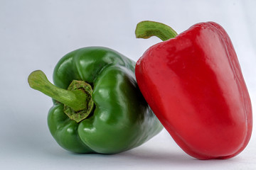 Organic green and red Bellpepper isolated on white background