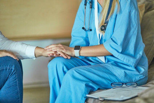 Hand Of Doctor Reassuring Her Female Patient