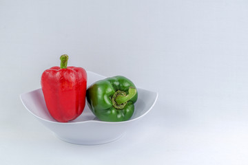 Organic green and red Bellpepper isolated on white background