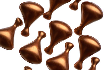 Golden cosmetic ampoules with face and eyelid cream isolated on white background