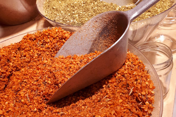 spices in a plate with a spoon close up