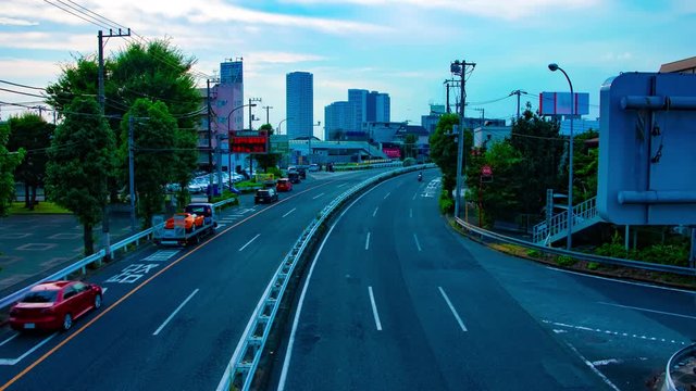 A timelapse of downtown street at Kanpachi avenue in Tokyo daytime wide shot panning