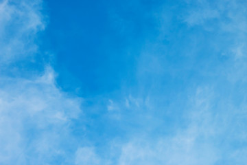 Obraz premium Blue sky with soft white clouds.