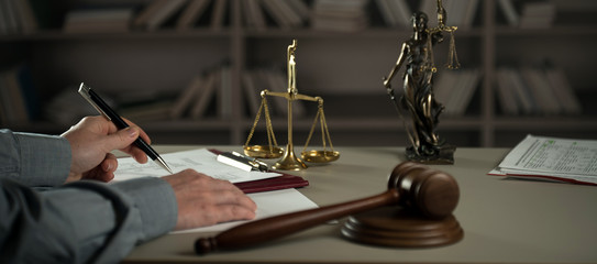  A lawyer working at a desk in a courtroom