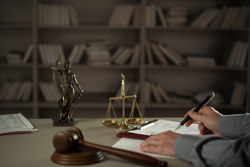  A lawyer working at a desk in a courtroom