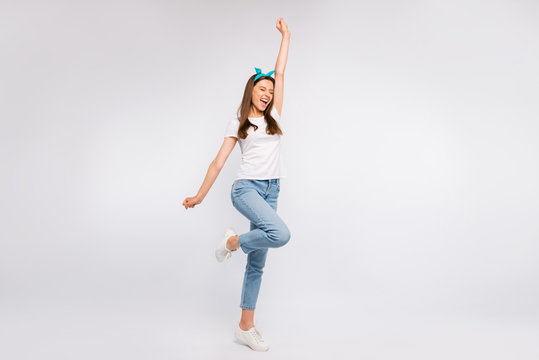 Full length photo of delighted crazy funky vintage style girl hear news about her victory raise fists scream yeah wear casual style outfit isolated over white color background
