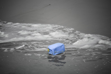 plastic tin hanging on the beach