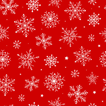 festive christmas seamless pattern with hand drawn snowflakes on red background