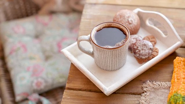 Fresh aromatic coffee and cookies on a wooden table. The comfort and atmosphere of the home. Autumn .