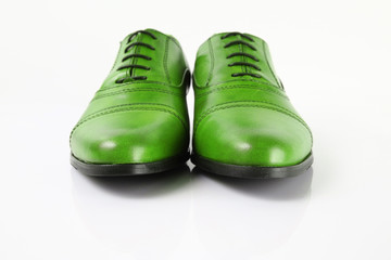 Pair of green shoes isolated on white background.