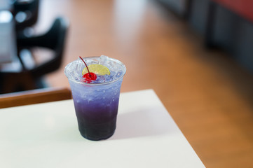 Magic Butterfly Pea Lemonade and soda water in plastic glass