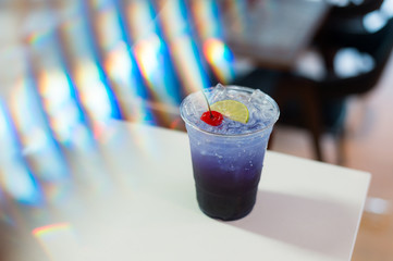 Magic Butterfly Pea Lemonade and soda water in plastic glass