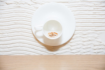 wedding rings in a circle, which is hanging on the wall