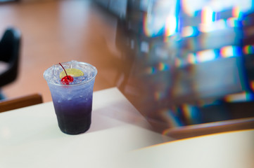 Magic Butterfly Pea Lemonade and soda water in plastic glass