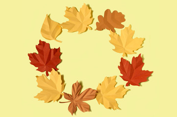 Colorful wreath of paper autumn leaves