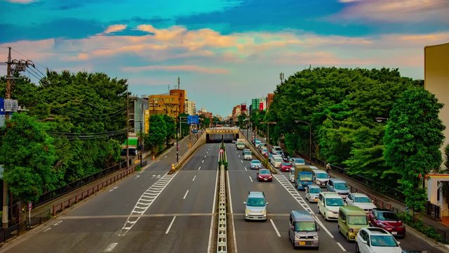 A timelapse of downtown street at Kanpachi avenue in Tokyo daytime wide shot tilt