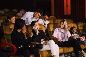 group of young people in cinema