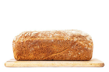 Loaf of bread on cutting board isolated on white