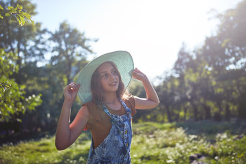 Fototapeta premium Cute ten year old girl posing in nature.