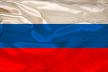 photo of the beautiful colored national flag of the modern state of Russia on textured fabric, concept of tourism, emigration, economics and politic