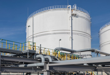 Oil storage tanks and pipes at the oil terminal 