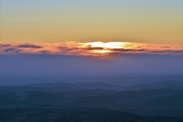 Fototapeta na wymiar A sunrise over the hills