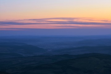 Fototapeta na wymiar sunset over the hills and valleys in Transylvania