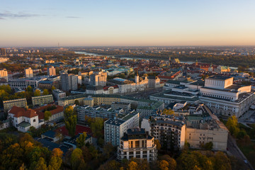 Fototapeta na wymiar Aerial view of the old town of Warsaw with the Vistula river. Panorama of the city at sunrise.