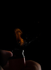 Hand with lighter igniting sparks