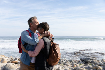 Couple embracing by the sea