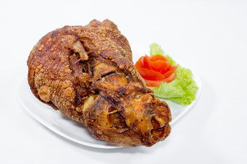 fried pork leg cooked on background
