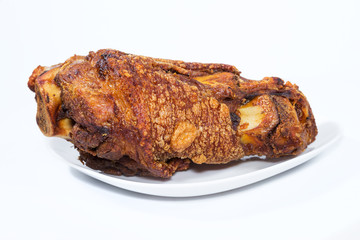 fried pork leg cooked on background