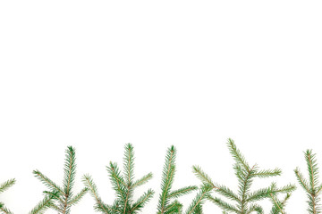 Christmas winter frame of fir-tree branches on white background. New Year background. Flat lay