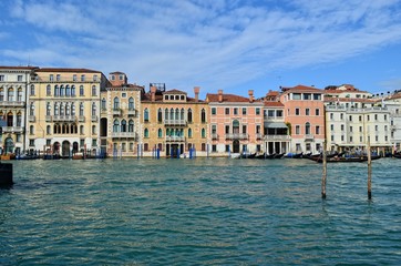 Fototapeta na wymiar wide Venetian canal with houses having a characteristic local style