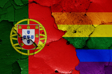 flags of Portugal and LGBT painted on cracked wall